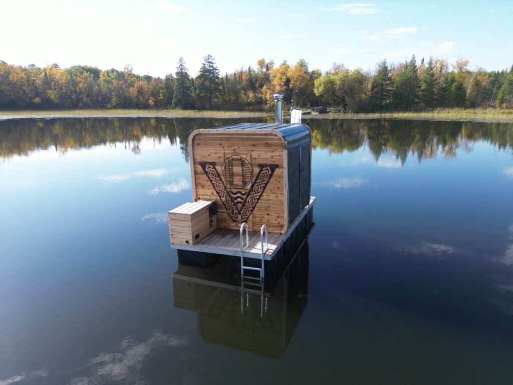 Valhallan floating sauna on a Minnesota lake with a swim ladder into the water