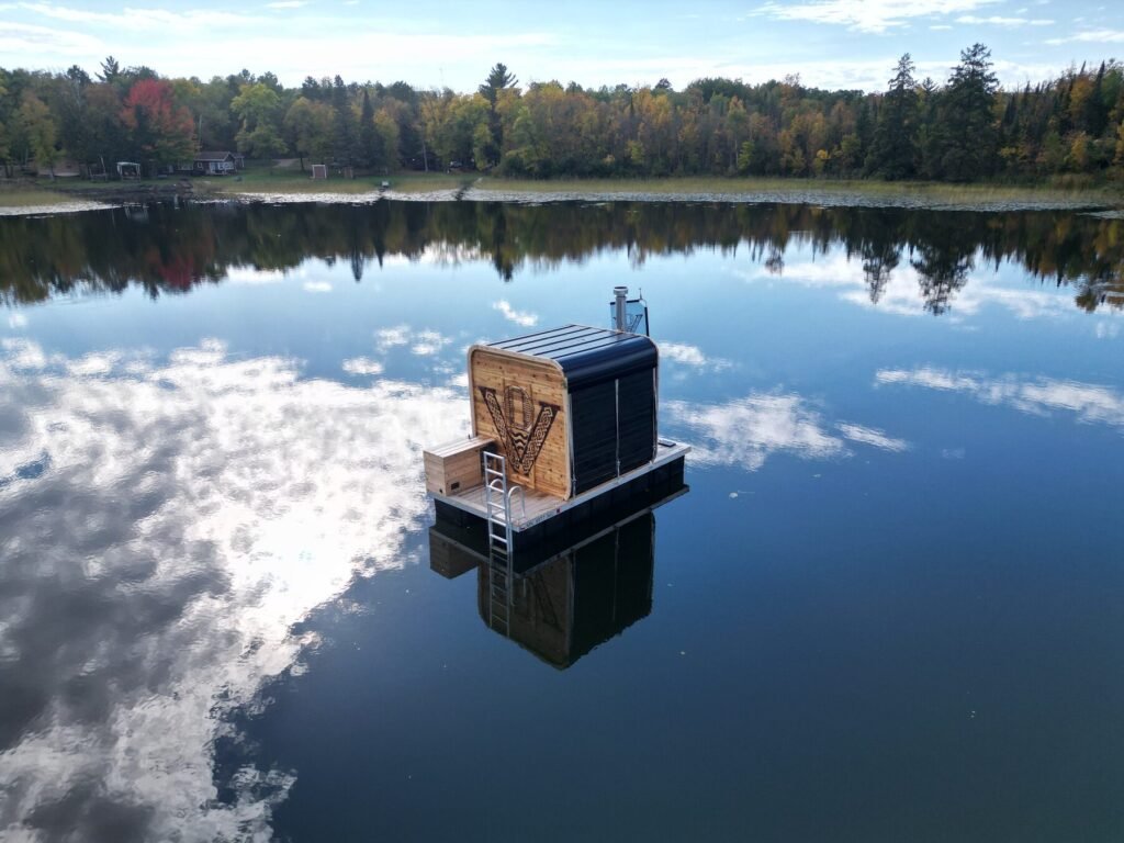 Valhallan floating sauna on a Minnesota lake surrounded by fall colors